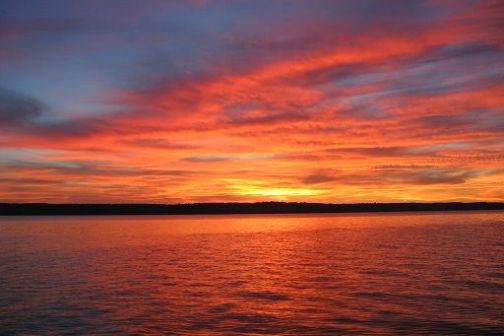 a sunset over a body of water