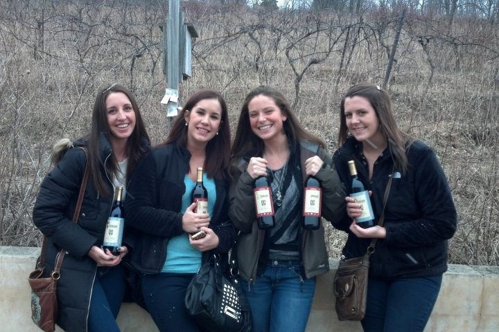 a group of people with wine