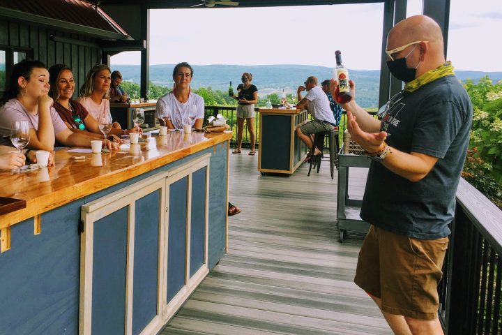 a group of people standing next to a fence
