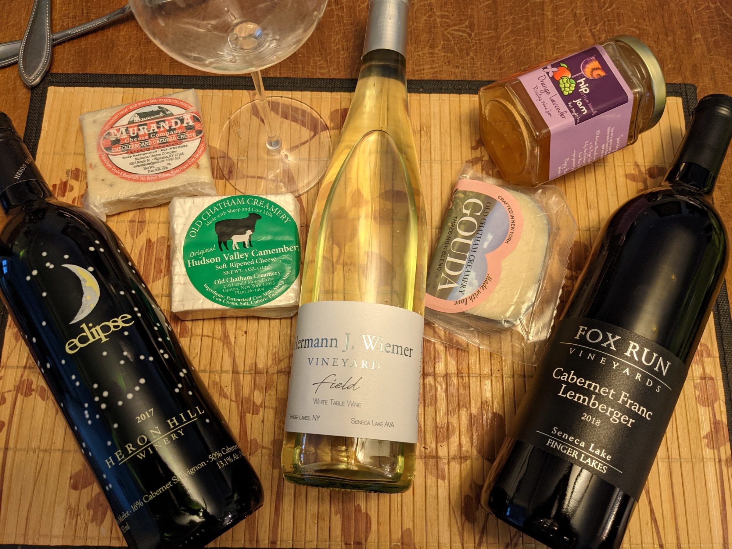 a bottle of wine sitting on top of a wooden table