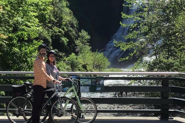 a person riding on the back of a bicycle