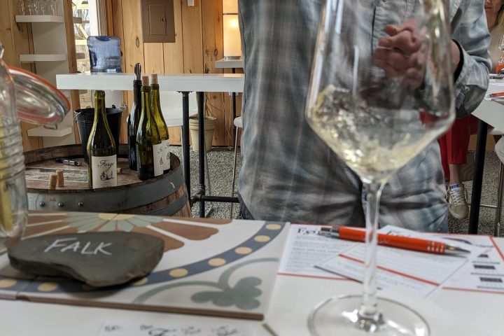 a man holding a glass of wine