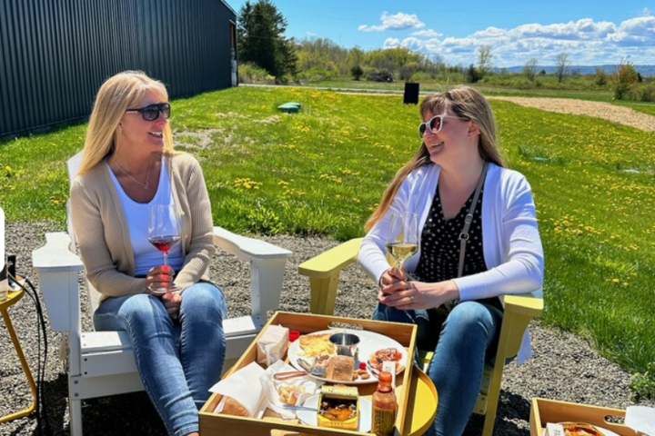 a group of people sitting at a picnic table