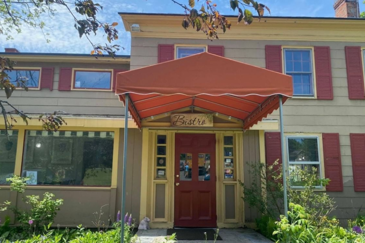 a house with bushes in front of a building