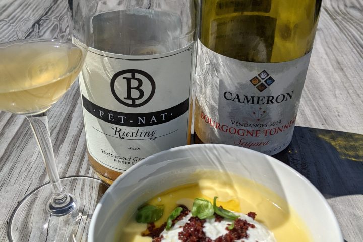 a plate of food and a bottle on a table
