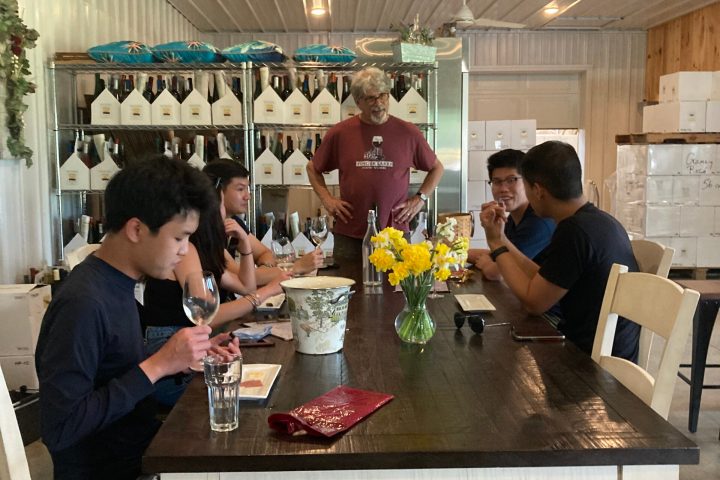 a group of people sitting at a table in a restaurant