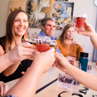 a woman holding a bottle