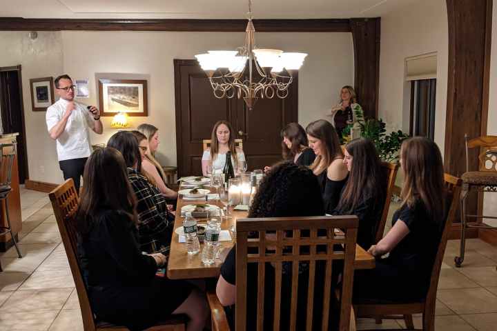 a group of people sitting at a table