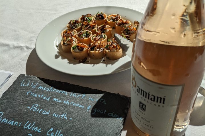 a plate of food and a bottle on a table