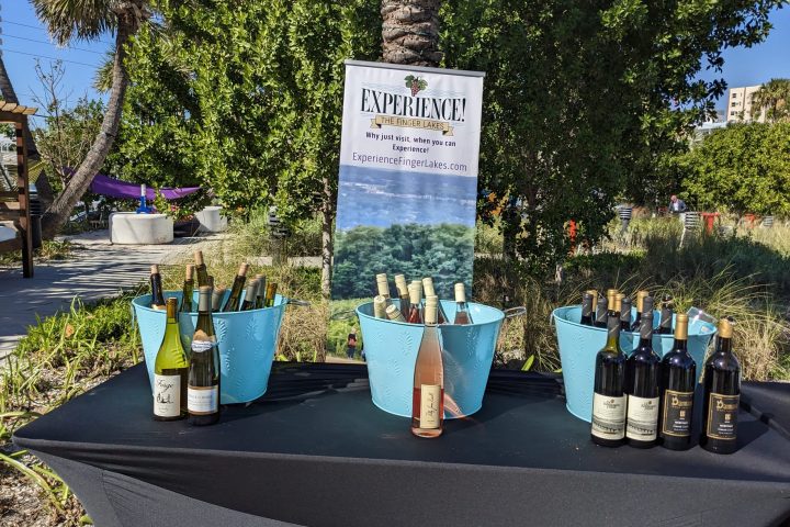 a bottle of wine next to a tree