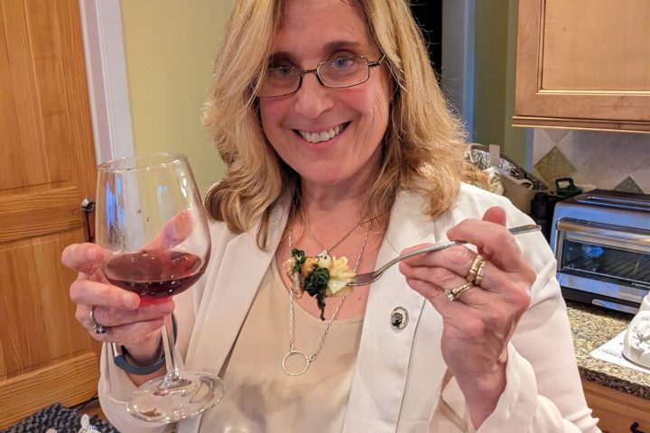 a woman holding a glass of wine