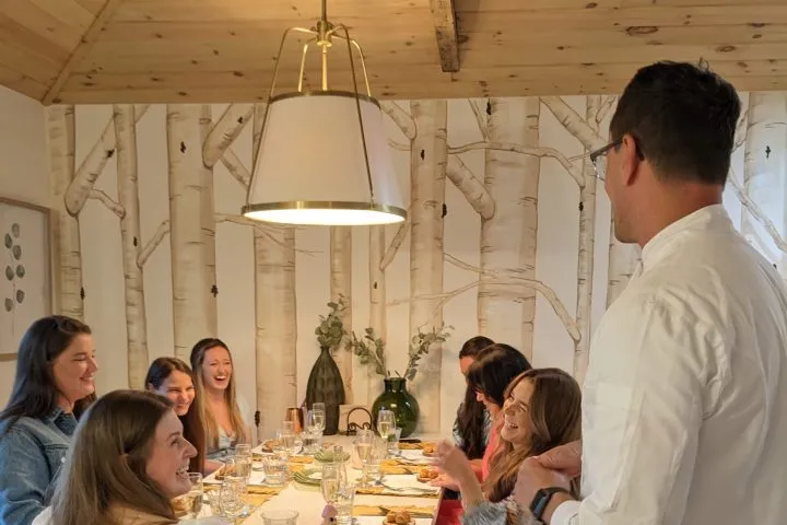a group of people sitting at a table