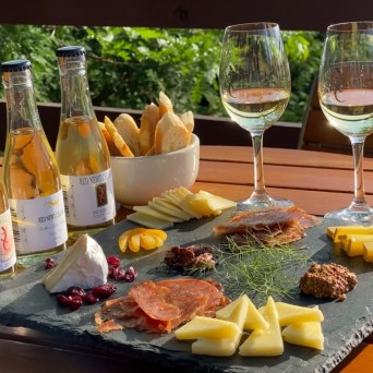 a group of people sitting at a table with wine glasses