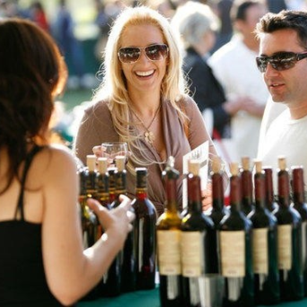 a group of people holding wine glasses