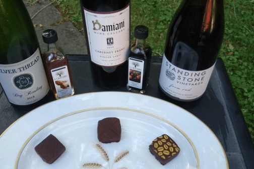 a plate of food and a bottle of wine