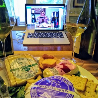 a plate of food and a glass of wine