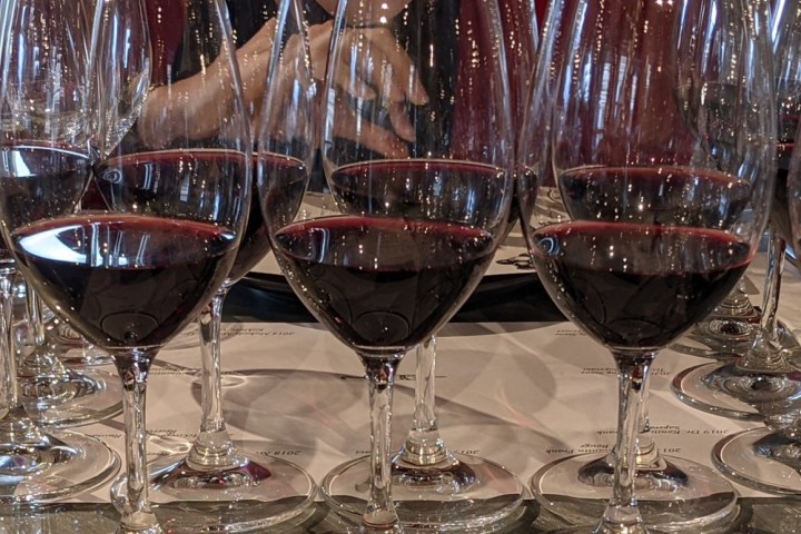 a table filled with wine glasses